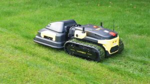 A Yarbo M1 automower with tracks, cutting a lawn.